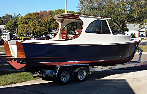 A nearly-ready-to-launch Berrypoint 26 A newly completed 26' picnic boat-style outboard cruiser, loaded on the boat-trailer and ready to launch